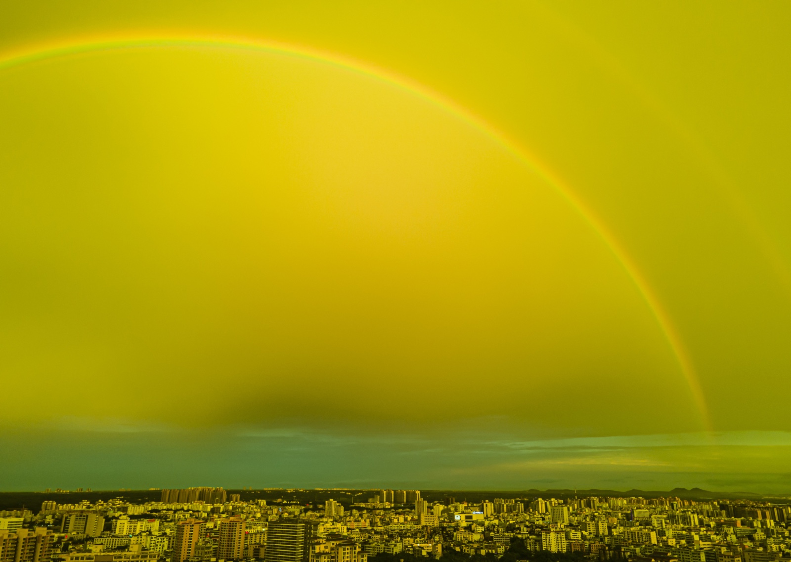 The skies above Qionghai, Hainan Province present rainbows and a variety of hues after a thunderstorm on June 2, 2024. /IC