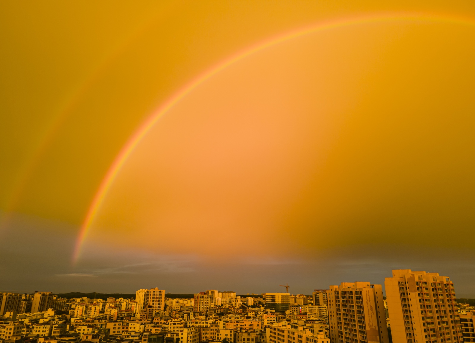 The skies above Qionghai, Hainan Province are shrouded in clouds and double rainbows after a thunderstorm on June 2, 2024. /IC