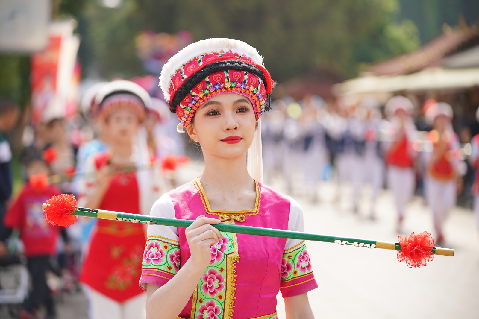 A file photo shows a Bai ethnic woman dressed in traditional costume taking part in the Raosanling festival in Kunming, Yunnan Province. /CFP