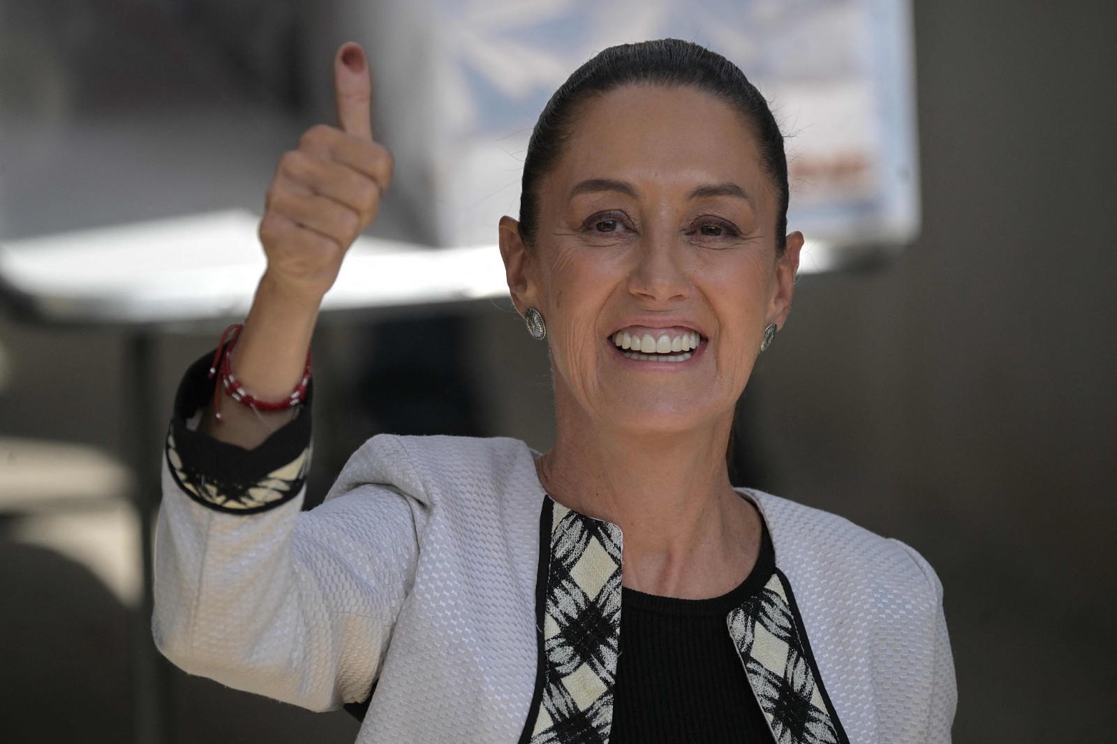 Mexico's presidential candidate for Morena party, Claudia Sheinbaum, shows her inked finger as she votes at a polling station in San Andres Totoltepec, Tlalpan, in Mexico City, Mexico, June 2, 2024. /CFP