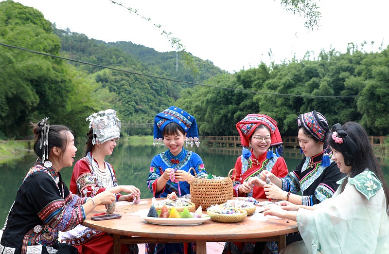 Local women prepare zongzi for the Dragon Boat Festival in Rong'an County, Liuzhou City, Guangxi Zhuang Autonomous Region, June 4, 2024. /CFP