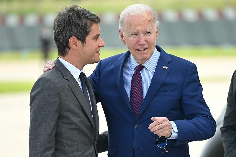 U.S. President Joe Biden (R) is welcomed by France's Prime Minister Gabriel Attal upon arrival at Paris Orly airport near Paris, France, June 5, 2024. /CFP