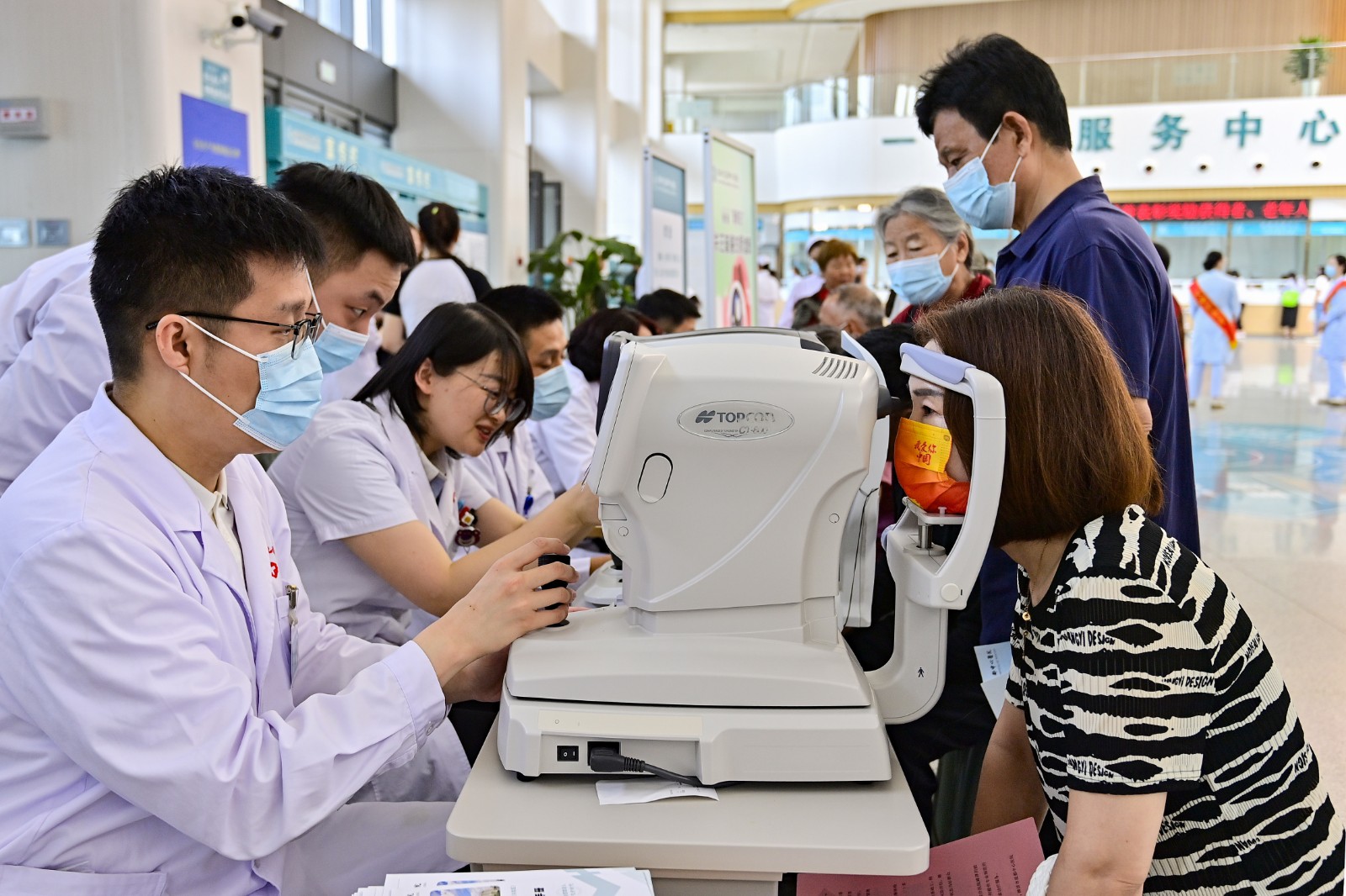 Eye specialists offer free medical services on the 29th National Eye Care Day at Yidu Central Hospital in Weifang, east China's Shandong Province, June 6, 2024. /CFP