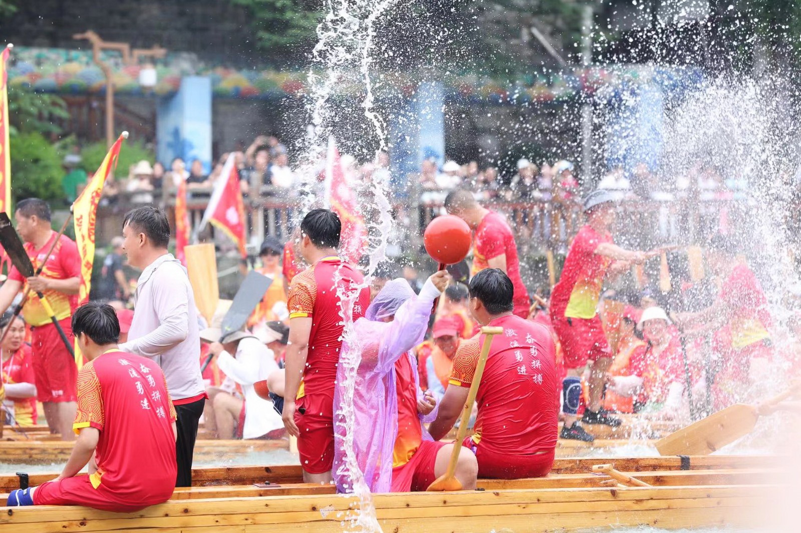 People participate in a dragon boat parade in Tongren City, Guizhou Province on June 1, 2024. /Photo provided to CGTN