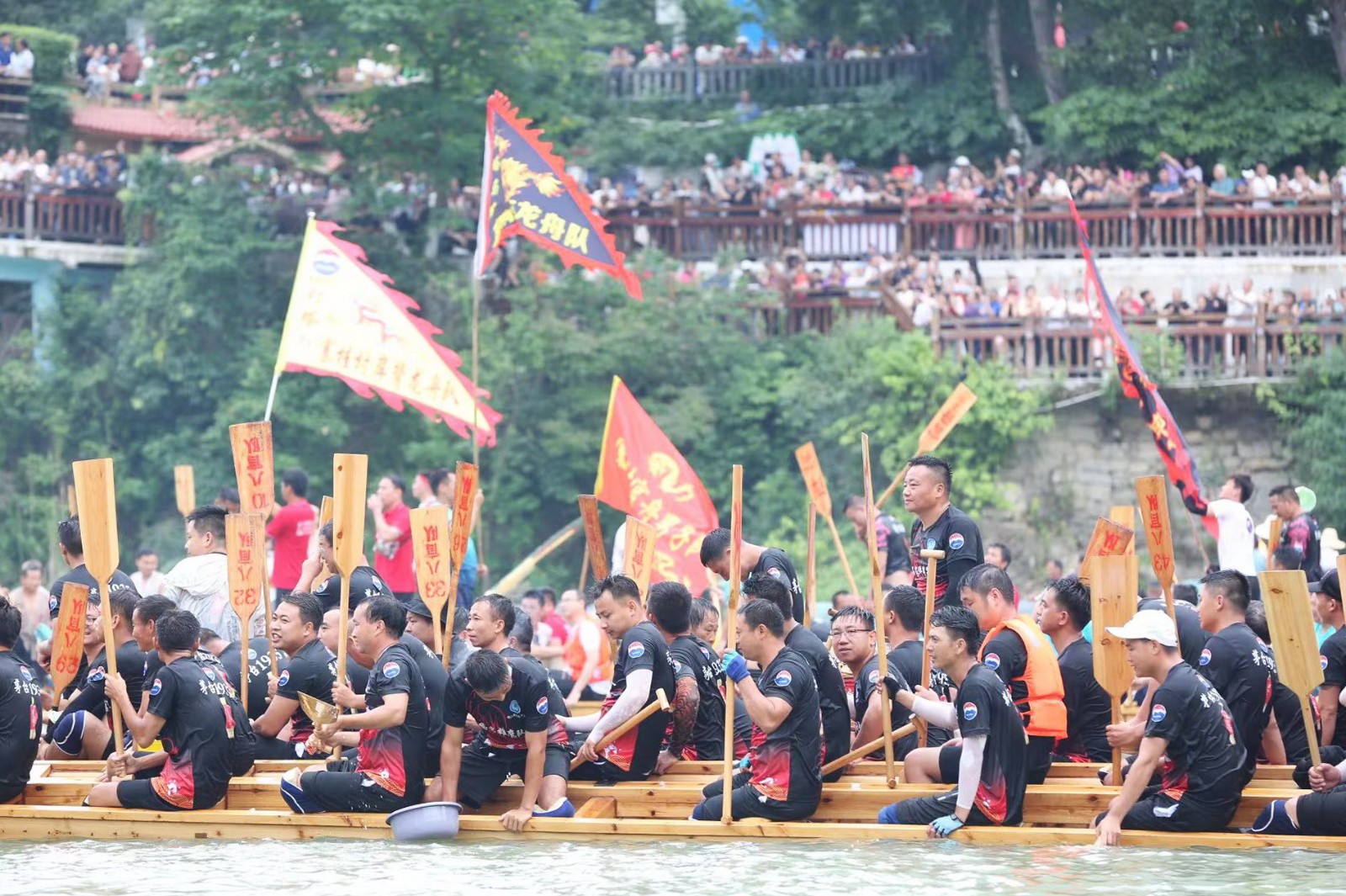 Enthusiastic rowers are captured at a dragon boat parade in Tongren City, Guizhou Province on June 1, 2024. /Photo provided to CGTN