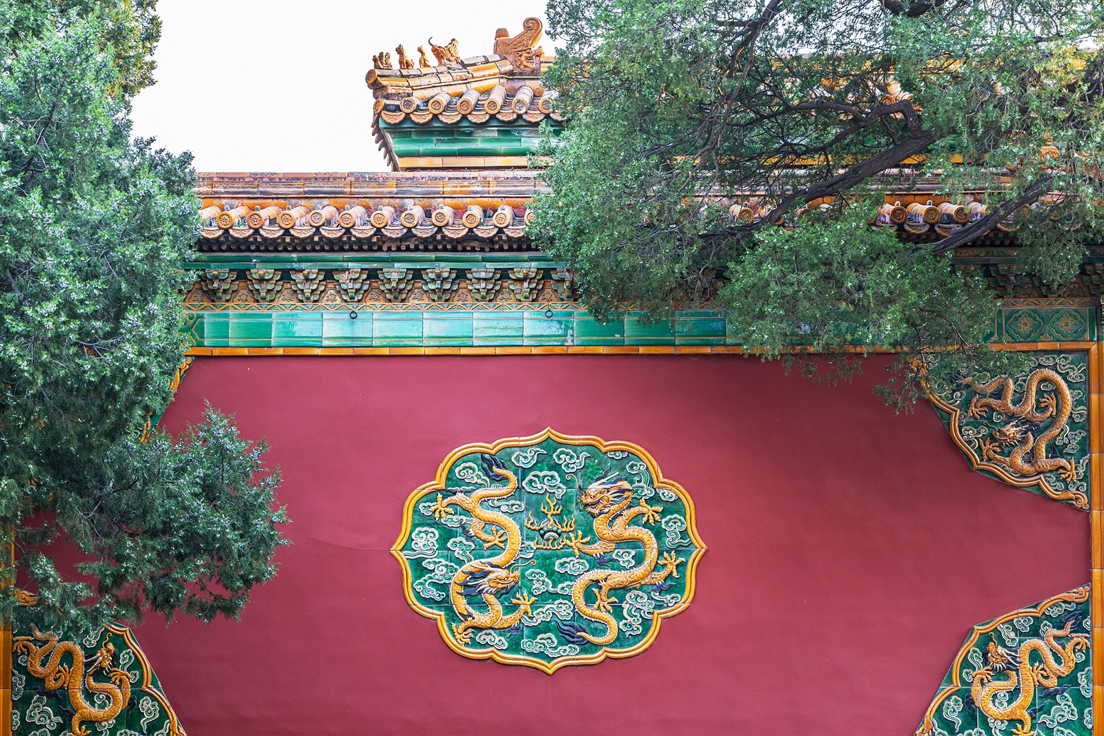 A wall adorned with green and yellow glazed tiles is seen at the Palace Museum in Beijing. /CFP