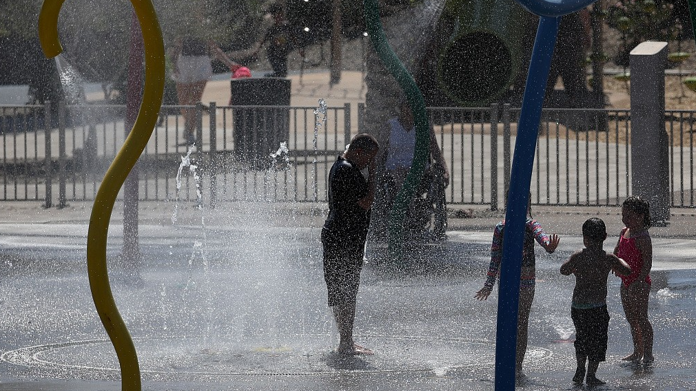 Kids play in a splash pad at Riverview Park in Mesa, Arizona, the U.S., June 5, 2024. /CFP