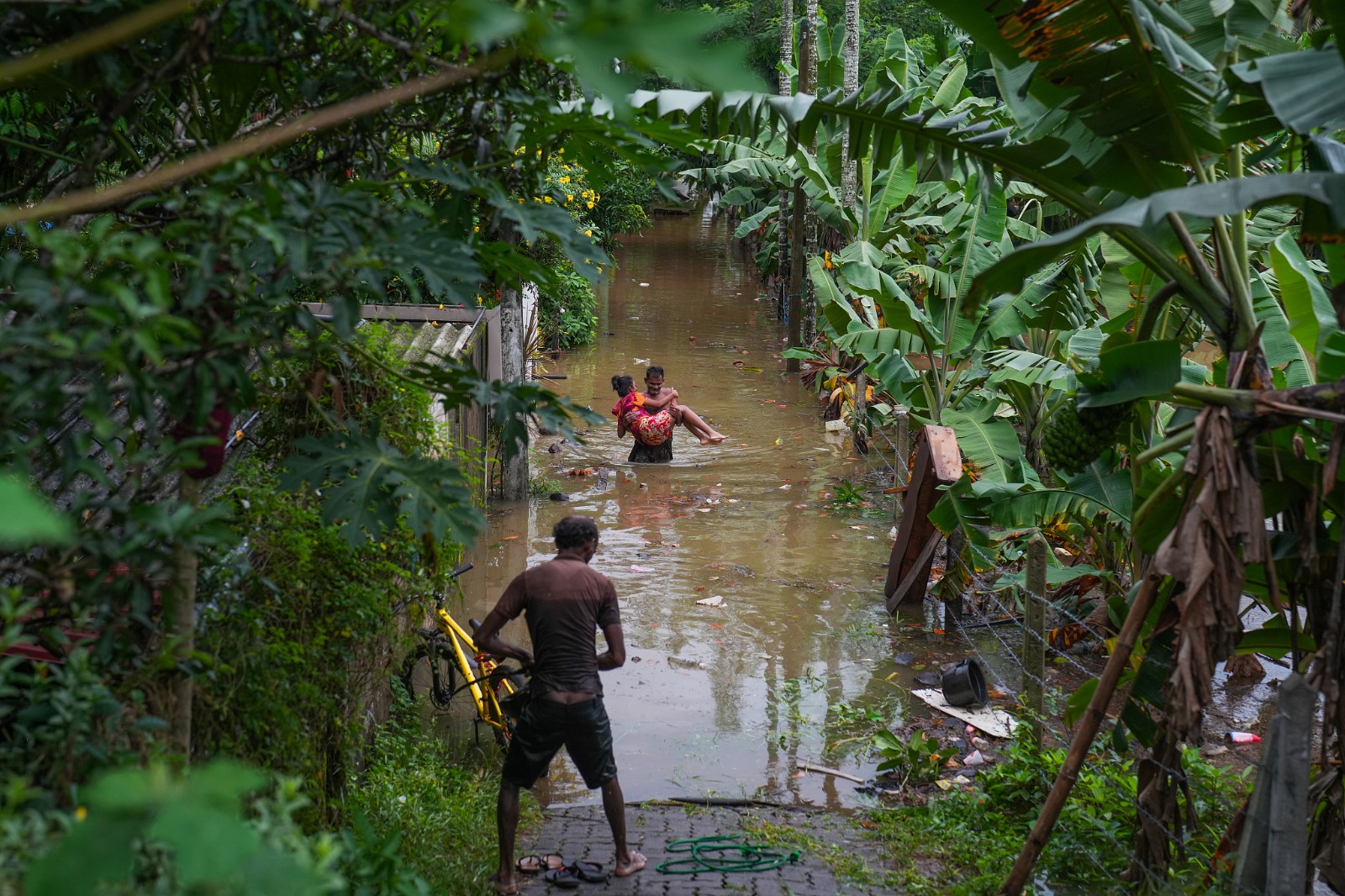 People are rescued from their houses through flood water in Kelaniya, Sri Lanka, on June 2, 2024. /CFP