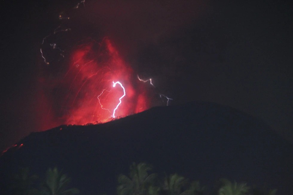 Lightning appears amid a storm as Mount Ibu spews volcanic material during an eruption, North Maluku province, Indonesia, June 6, 2024. /Reuters