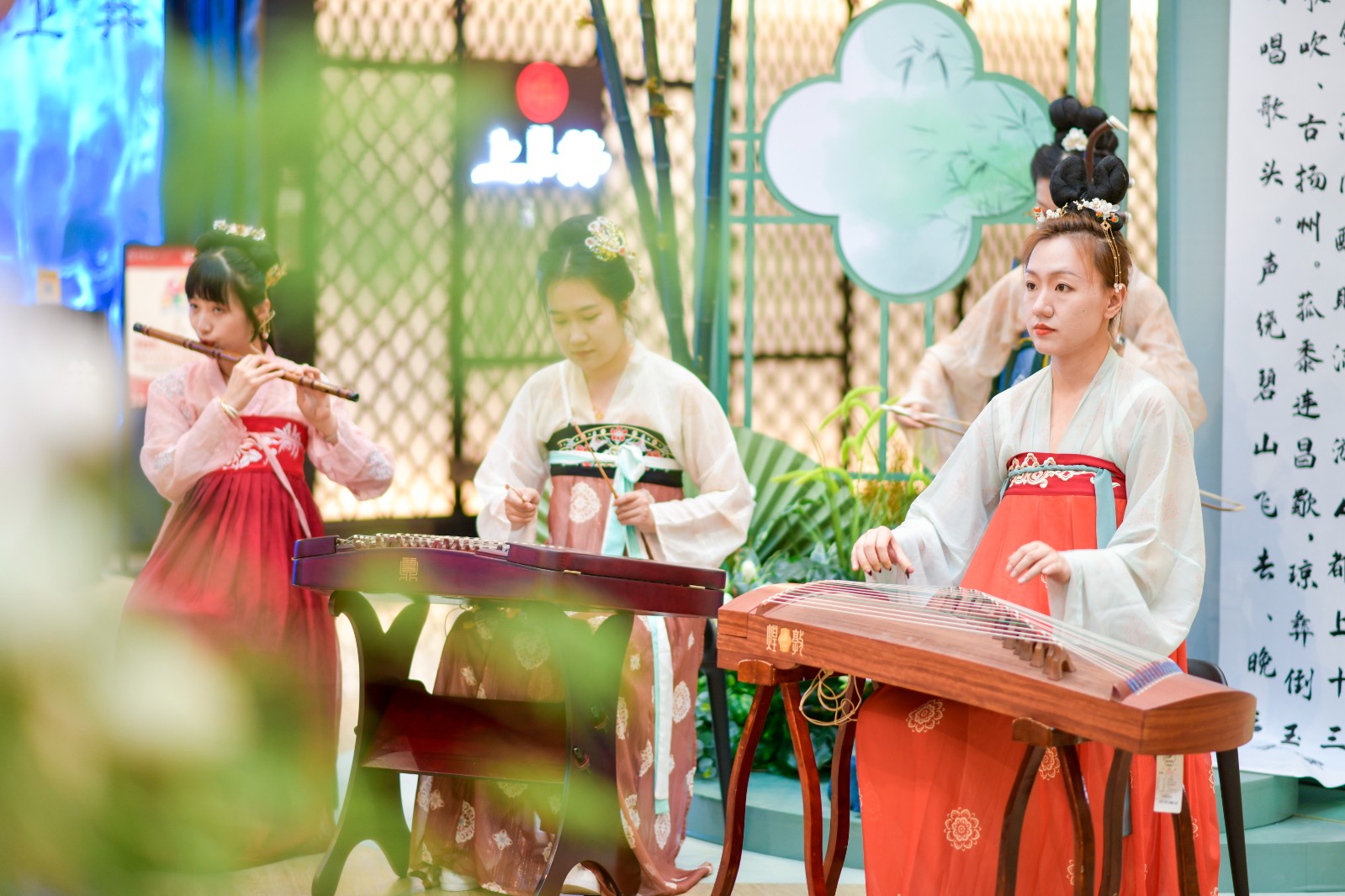 A file photo shows folk musicians dressed in hanfu attire playing music at a traditional Chinese culture-themed fair held in Jinan, Shandong Province to celebrate Duanwu Festival, or Dragon Boat Festival. /IC
