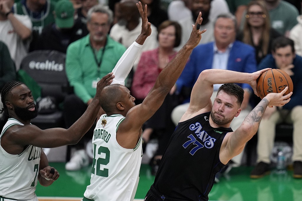 Luka Doncic (#77) of the Dallas Mavericks passes in Game 1 of the NBA Finals against the Boston Celtics at TD Garden in Boston, Massachusetts, June 6, 2024. /CFP