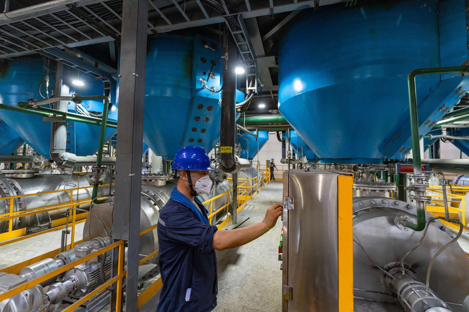 A technician checks reactor operation on a production line of Gotion High-Tech, Hefei City, east China's Anhui Province. /CFP