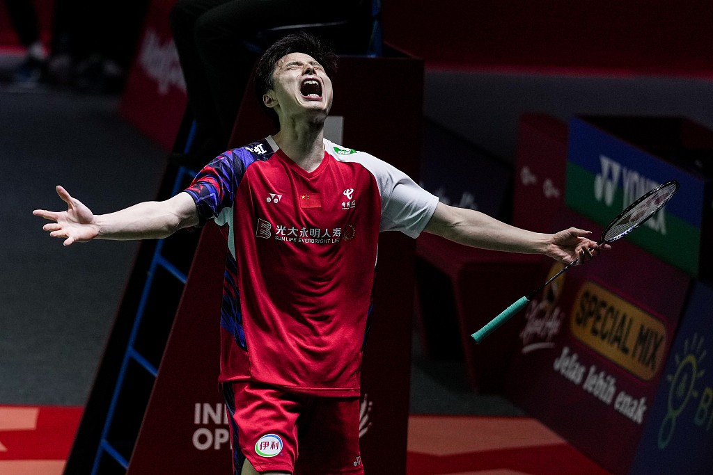 Shi Yuqi of China celebrates after defeating Anders Antonsen of Denmark 21-9, 12-21, 21-14 in the men's singles final at the Indonesia Open in Jakarta, Indonesia, June 9, 2024. /CFP