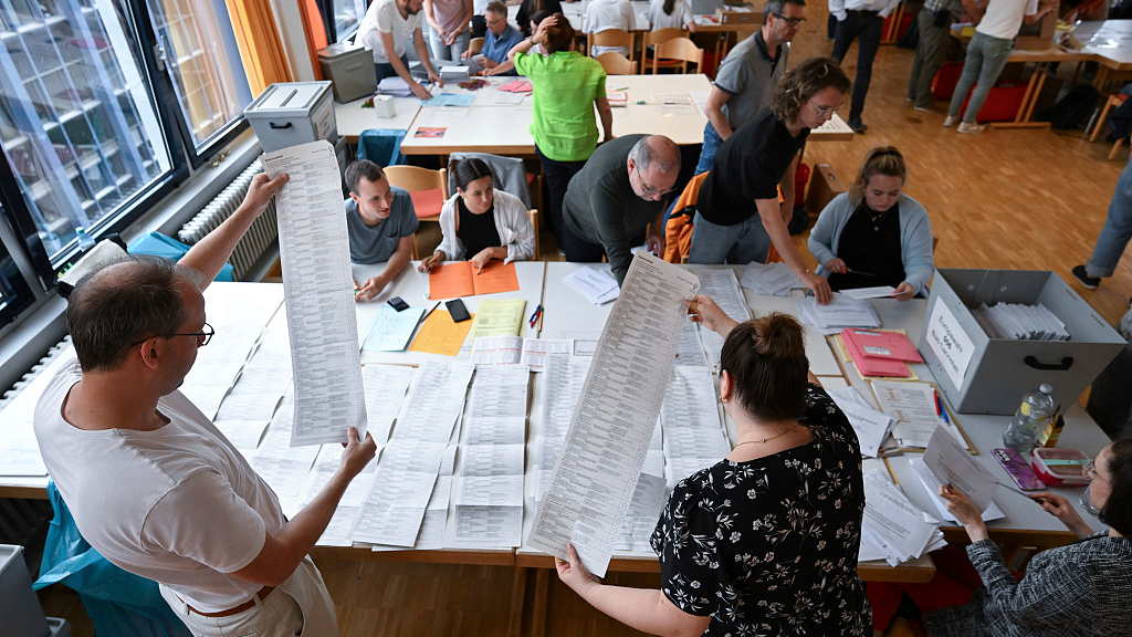 Election staffers work at the Schwabenzentrum counting postal votes for the European elections in Stuttgart, Germany, June 9, 2024. /CFP