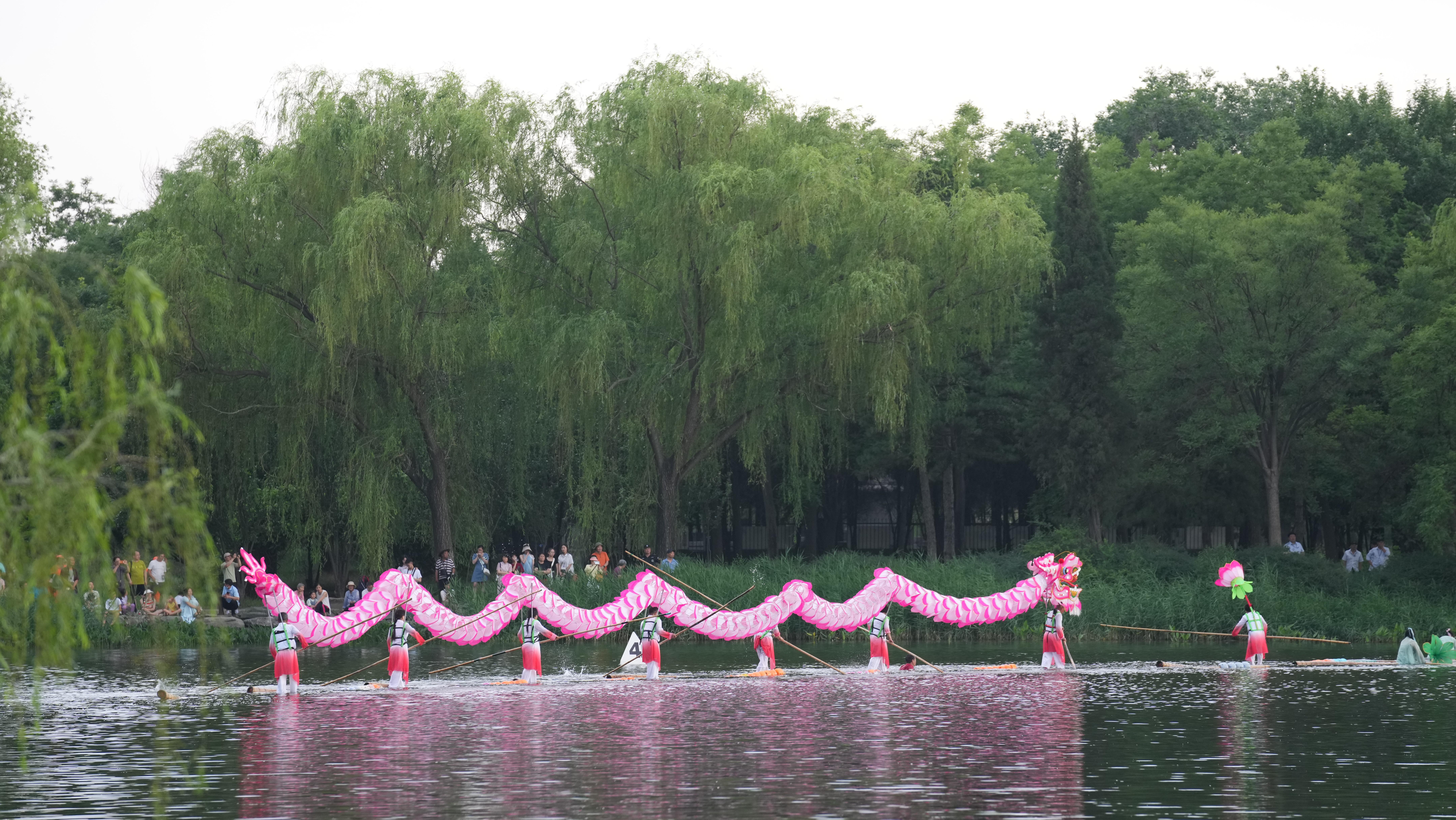 A bamboo raft performance takes place on the lake at Yuanmingyuan Park in Beijing, June 10, 2024. Chen Bo/CGTN
