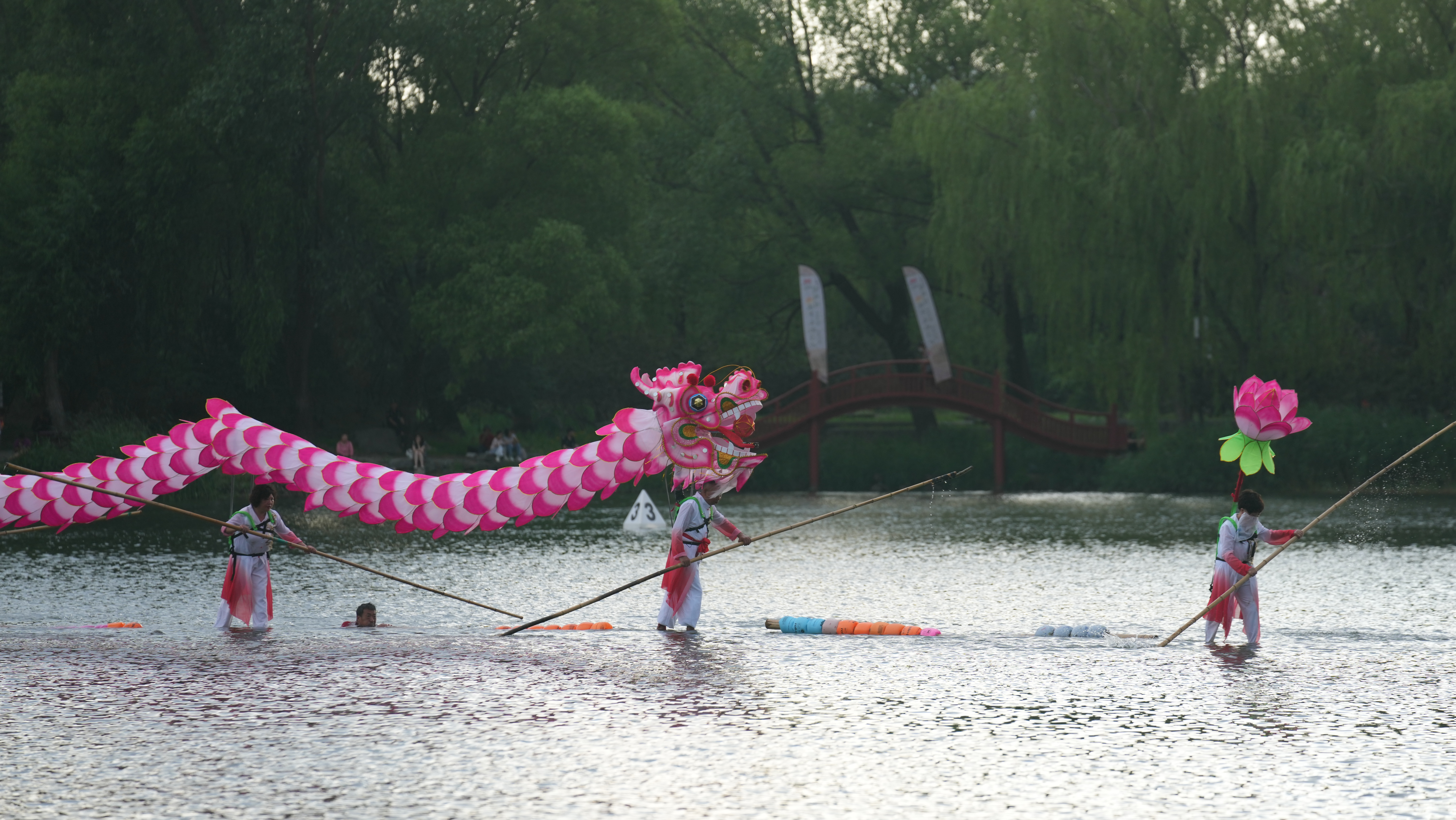 A bamboo raft performance takes place on the lake at Yuanmingyuan Park in Beijing, June 10, 2024. Chen Bo/CGTN