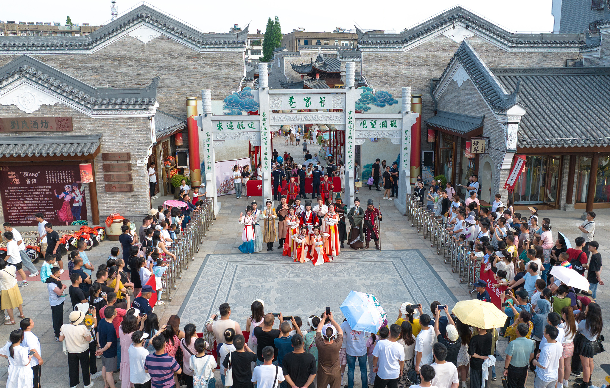 Tourists enjoying folklore performances at Xiangyang Ancient City, Hubei Province, China, June 9, 2024. /CFP