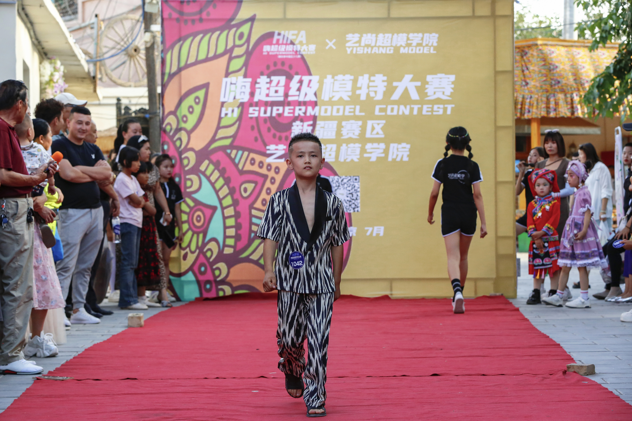 A male contestant is pictured at a modeling contest in Kuqa City, Xinjiang on June 9, 2024. /CFP