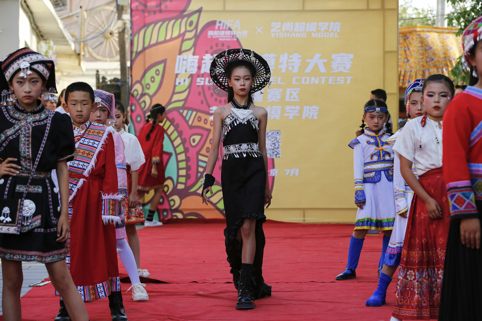 Models pose on the catwalk at a contest held in Kuqa City, Xinjiang on June 9, 2024. /CFP