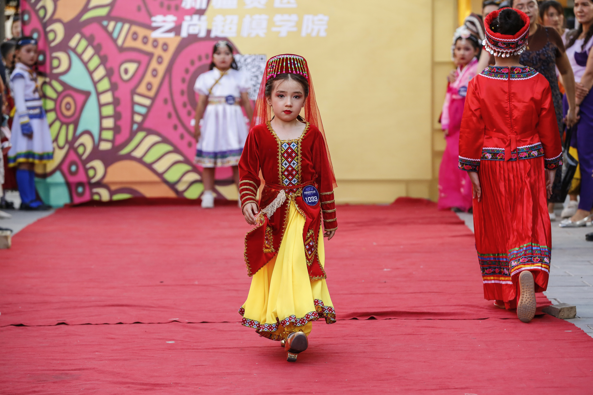Girls walk down the catwalk at a modeling contest in Kuqa City, Xinjiang on June 9, 2024. /CFP