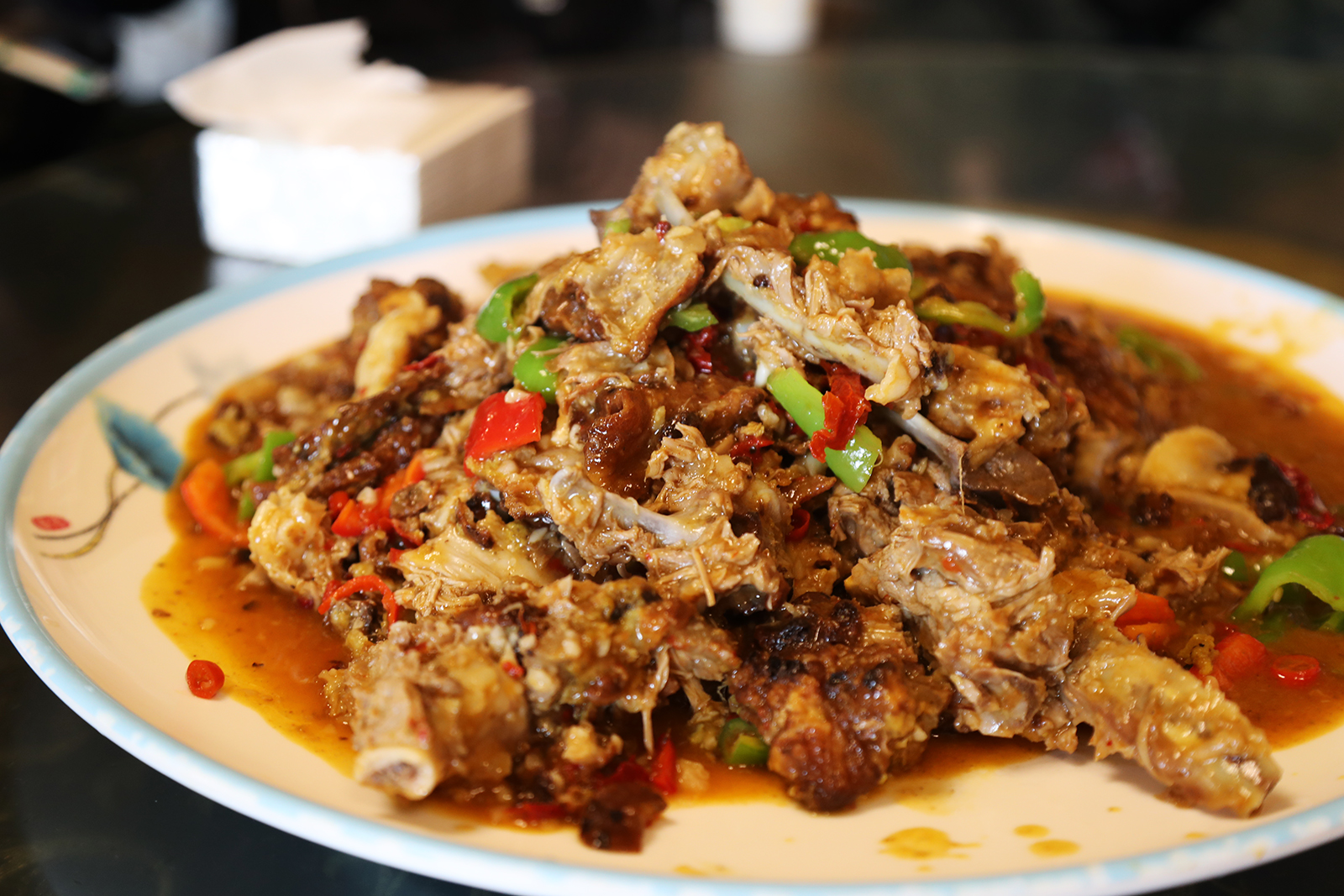 A dish of lamb with abundant spices and seasonings is a typical example of Xinjiang cuisine. /CGTN
