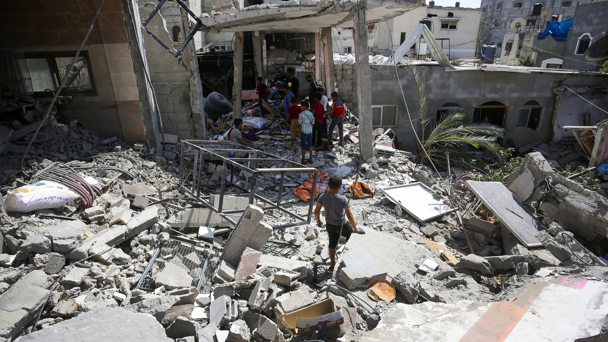 A view of the destruction as Palestinians conduct a search and rescue operations among the rubbles after Israeli warplanes targeted a house in the Nuseirat refugee camp area in Gaza, June 9, 2024. /CFP