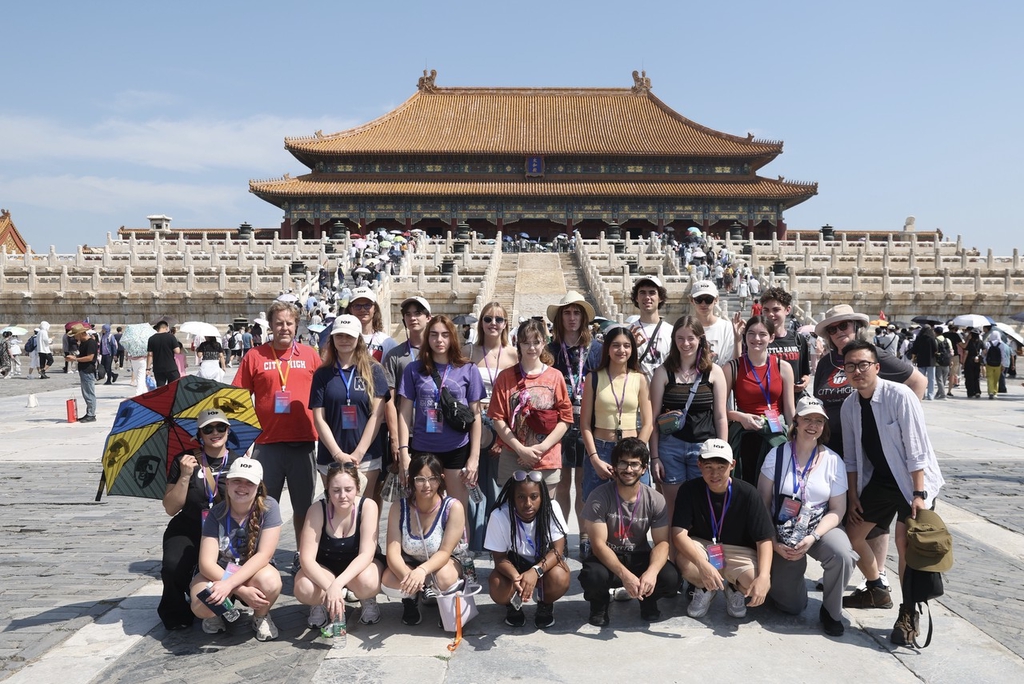 A photo taken on June 11, 2024 shows students and teachers from the U.S. state of Iowa taking a group photo at the Palace Museum in Beijing, China./IC