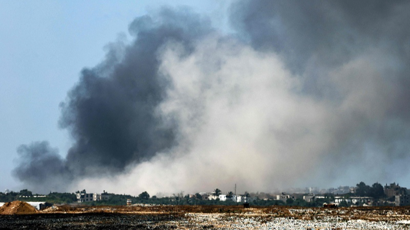 A plume of smoke from an explosion billows in the Gaza Strip as seen from a position along Israel's southern border with the Palestinian territory, May 15, 2024. /CFP