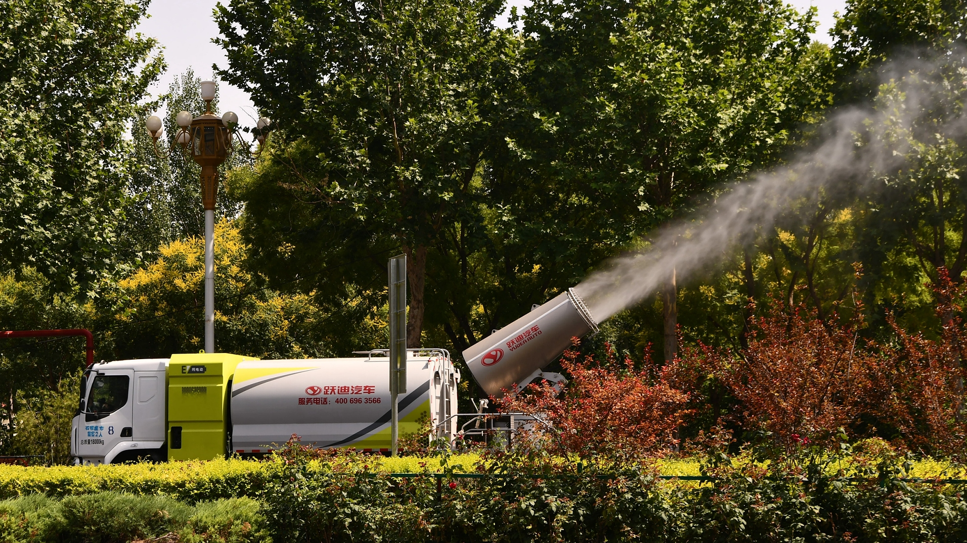 A water truck sprays water onto the road to lower the temperature on Luanwu Road, Luancheng District, Shijiazhuang, Hebei Province, China, June 12, 2024. /CFP