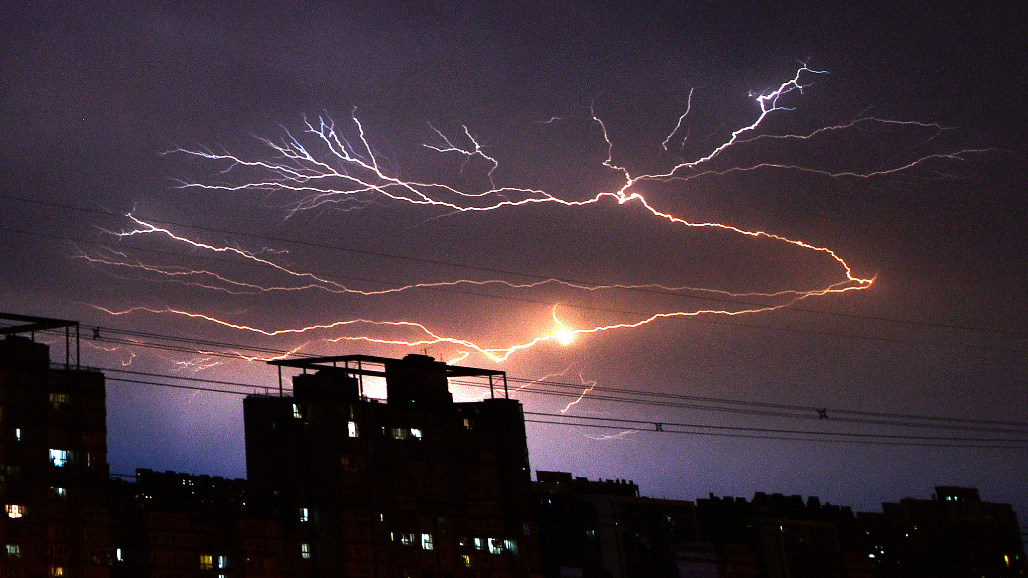 Lightening in the sky over Beijing during a thunderstorm, June 12, 2024. /CFP