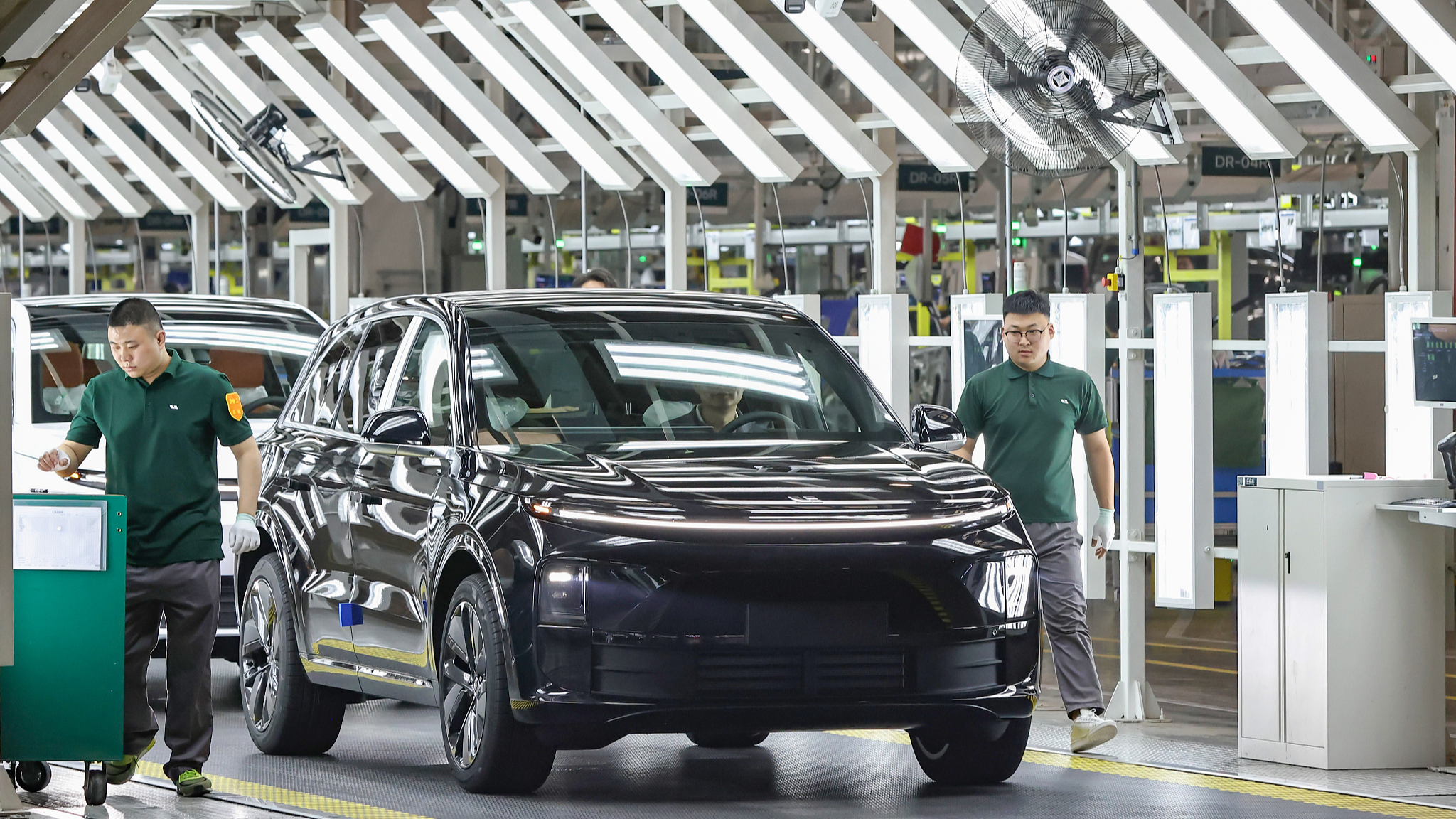 Workers pictured on a car production line in Changzhou, Jiangsu Province, May 31, 2024. /CFP