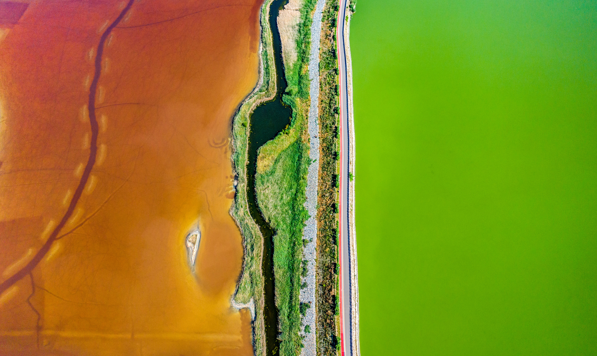 An aerial photo captures the symmetrical beauty of Yuncheng Salt Lake in Shanxi Province on June 12, 2024. /CFP