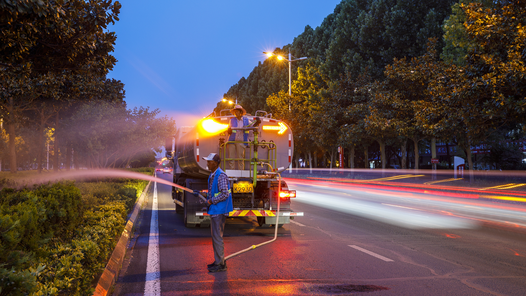 In Lianyungang City of east China's Jiangsu Province, landscape workers utilized the nighttime to water green spaces to combat drought on June 13, 2024. /CFP