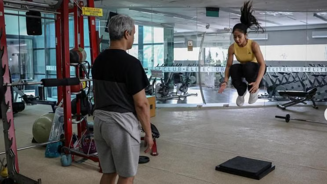 Rifda Irfanaluthfi (R) trains at a gym in Jakarta, Indonesia, May 8, 2024. /Reuters
