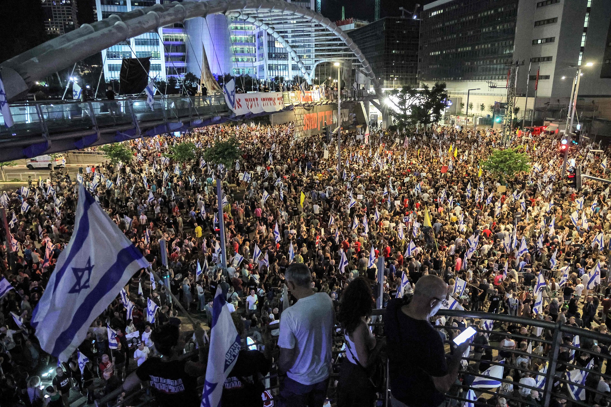 Protesters gather during an anti-government demonstration outside the Defence Ministry headquarters in Tel Aviv on June 15, 2024. /CFP