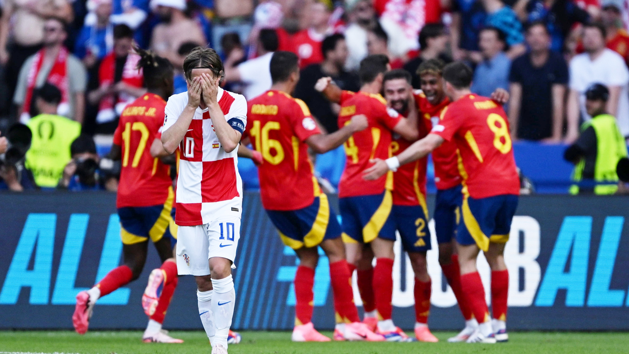 Croatia's Luka Modric #10 covers his face while Spanish players celebrate a goal during the Euro 2024 Group B opener in Berlin, Germany, June 15, 2024. /CFP