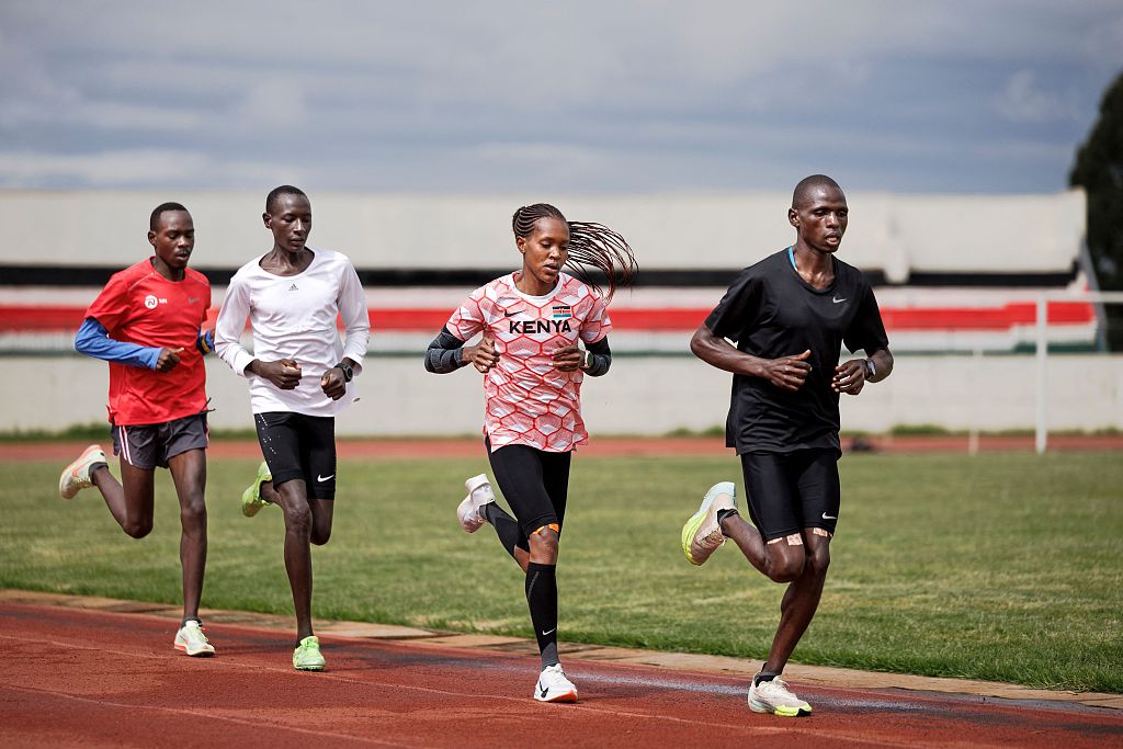 Faith Kipyegon (2nd R) of Kenya runs with fellow athletes during a training session for the Paris Olympics at the Kipchoge Keino Stadium in Eldoret, Kenya, May 4, 2024. /CFP