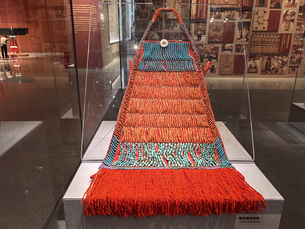 A hanging woven piece is seen on display at the 