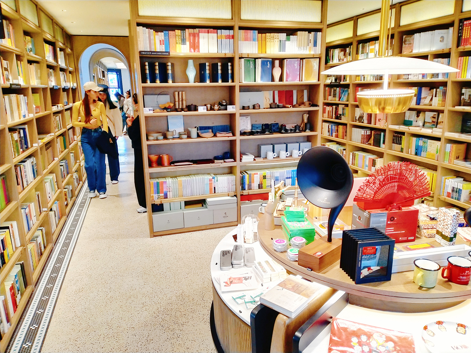 Visitors walk around a music-theme bookstore at the Blackstone Apartments in Shanghai. /IC