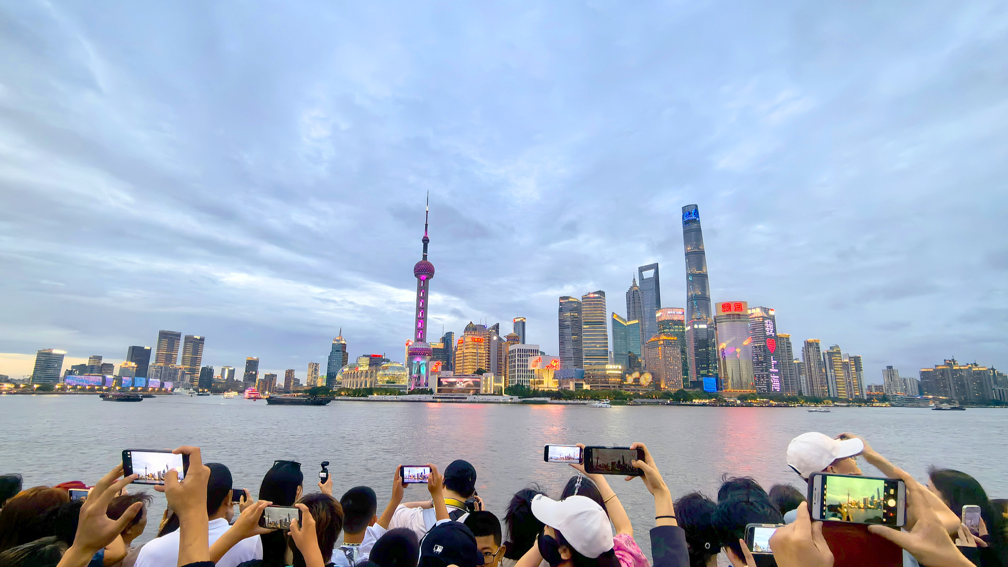 Tourists taking photos of the Bund, Shanghai, China, June 10, 2024. /CFP