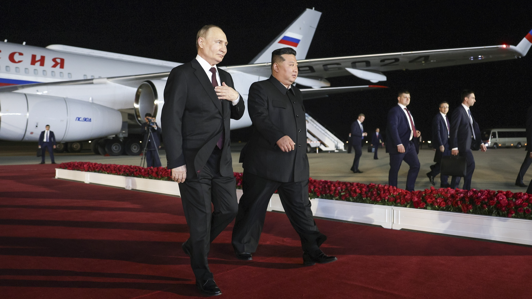 Russian President Vladimir Putin (L) and DPRK's top leader Kim Jong Un walk together at Pyongyang International Airport in Pyongyang, DPRK, June 18, 2024. /CFP