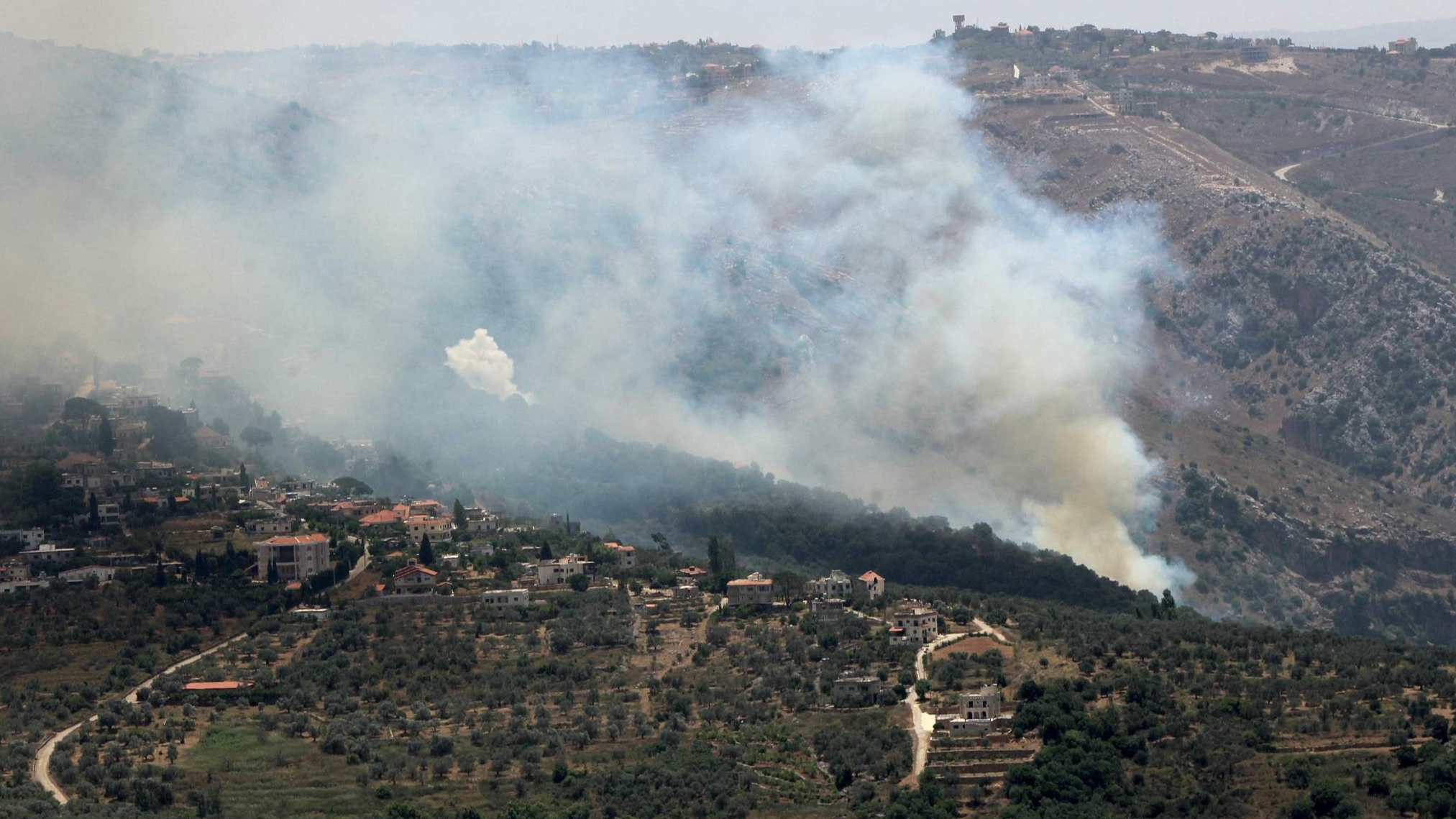 Smoke billows from fires ignited by Israeli shelling on the forested areas of the southern Lebanese village of Deir Mimas, June 15, 2024. /CFP