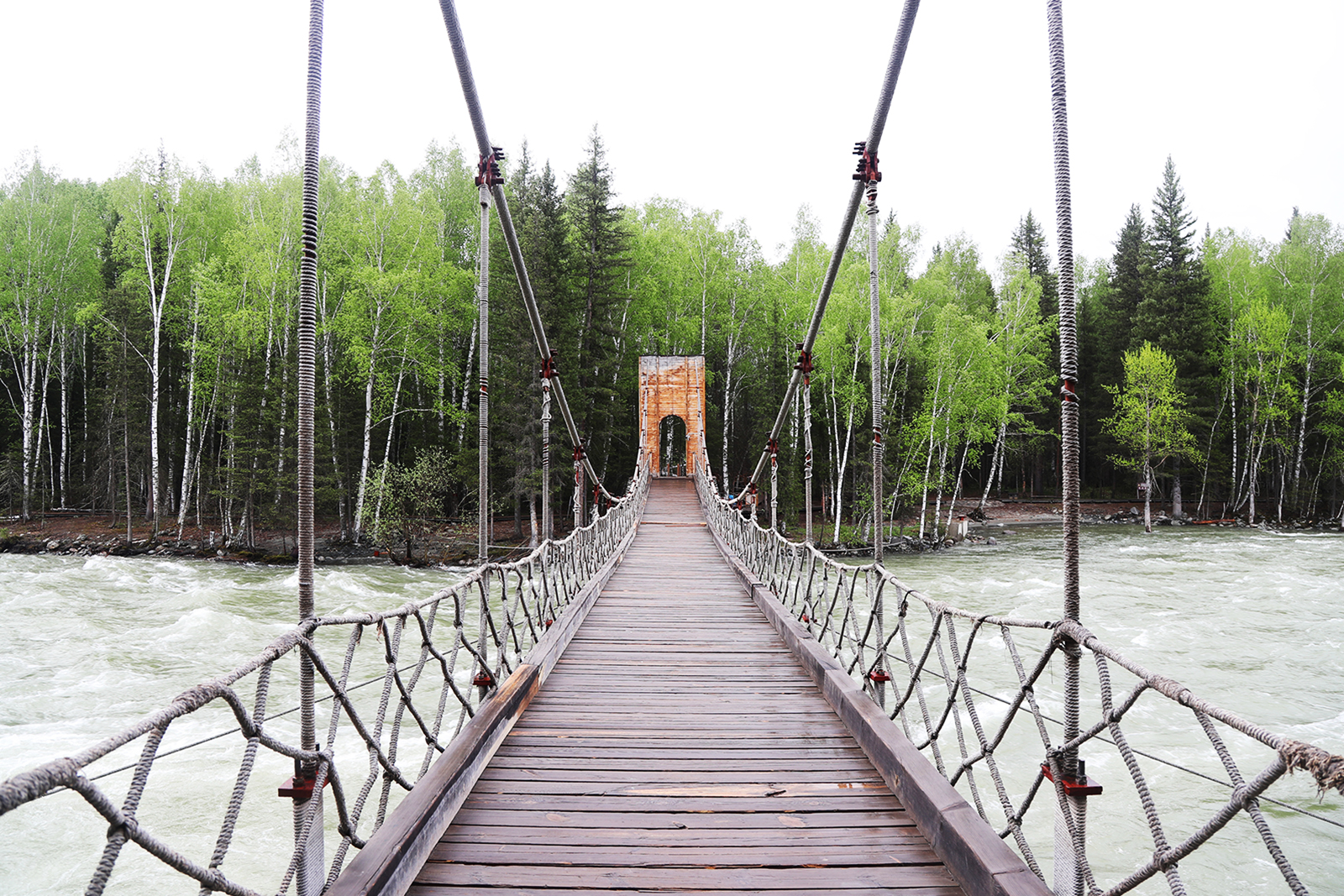 A bridge spanning Hemu River is seen in Hemu village in Altay, Xinjiang. /CGTN