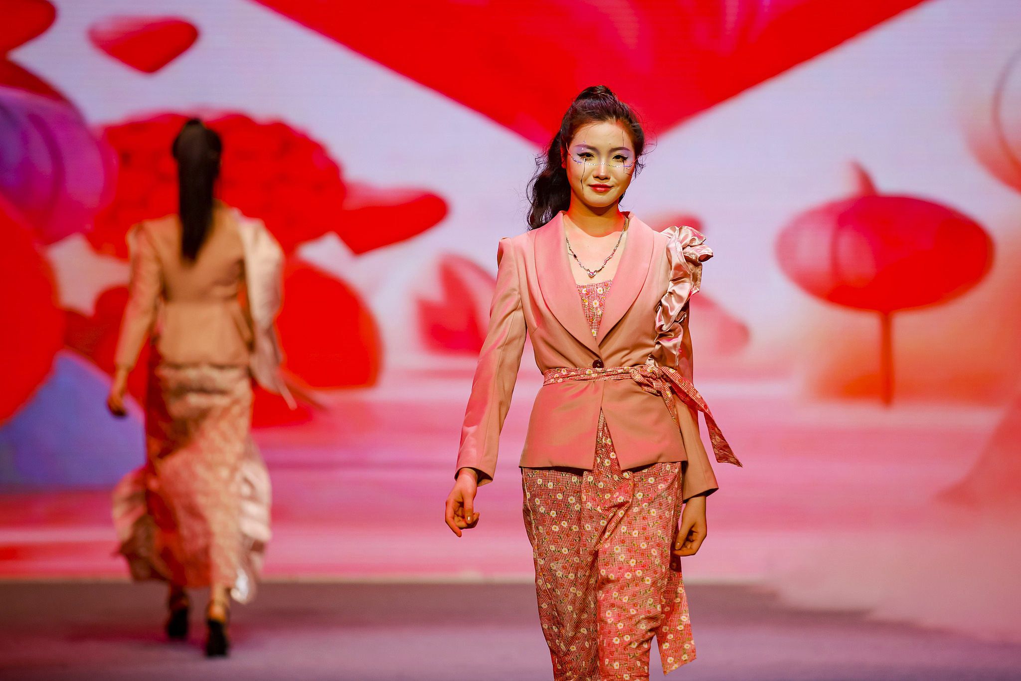 Models display garments at a fashion show showcasing students' graduation projects at Quanzhou College of Technology in Fujian Province on June 18, 2024. /CFP