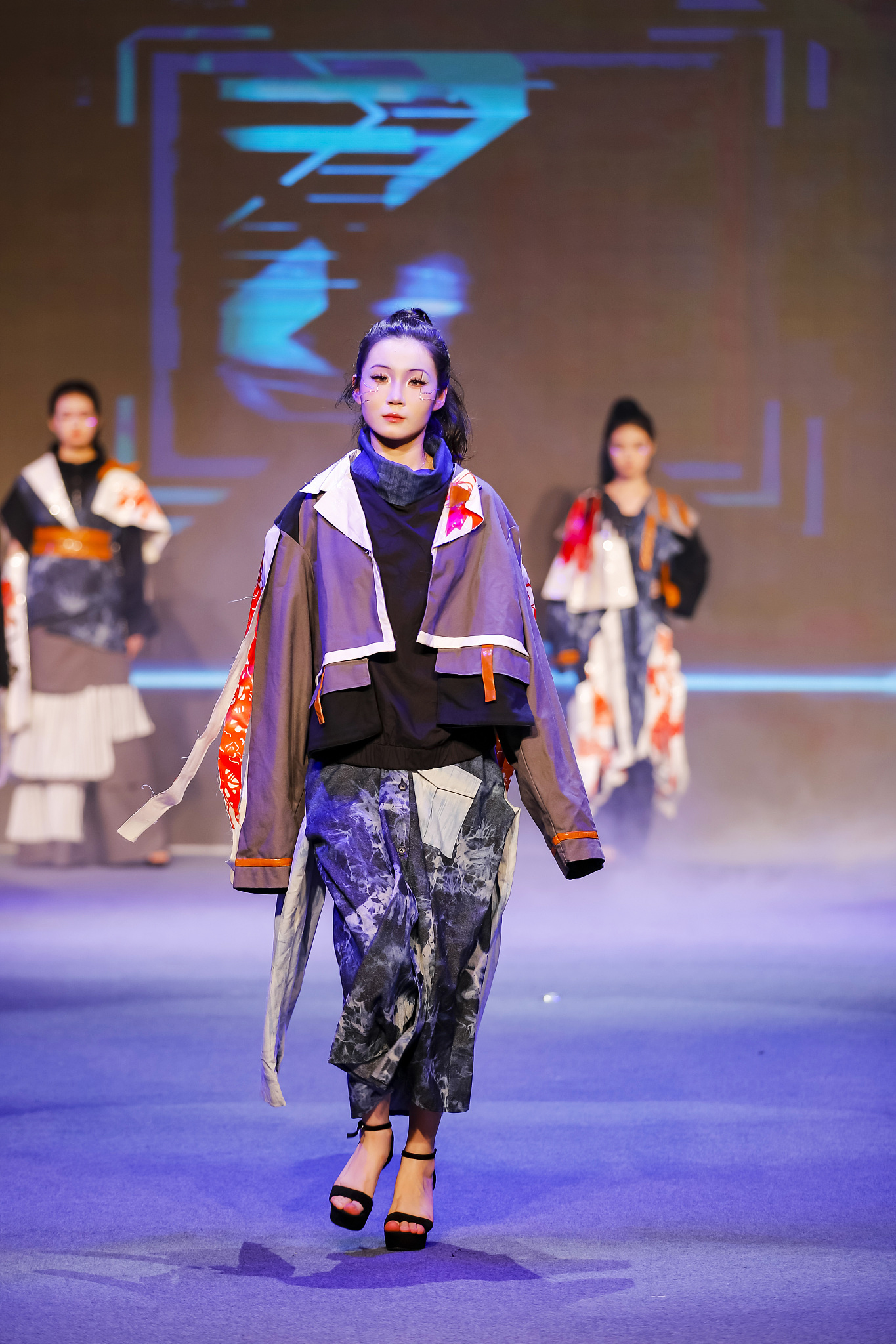 Models display garments at a fashion show showcasing students' graduation projects at Quanzhou College of Technology in Fujian Province on June 18, 2024. /CFP