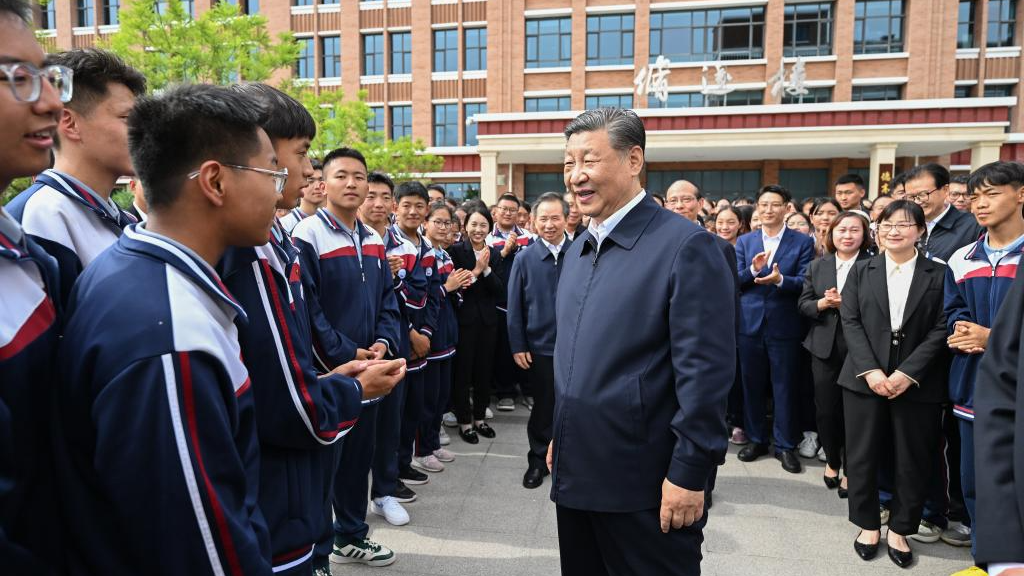 Chinese President Xi Jinping, also general secretary of the Communist Party of China Central Committee and chairman of the Central Military Commission, visits a middle school in Xining, northwest China's Qinghai Province, June 18, 2024. /Xinhua