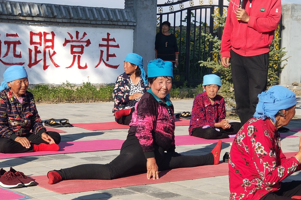 Elderly residents are seen in an undated photo practicing yoga in Yugouliang Village, Hebei Province. /IC