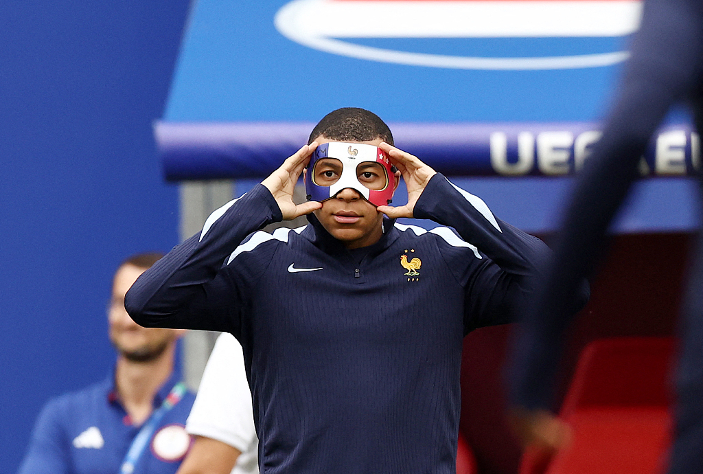 Kylian Mbappe of France wears a mask during team preactice in Leipzig, Germany, June 20, 2024. /CFP