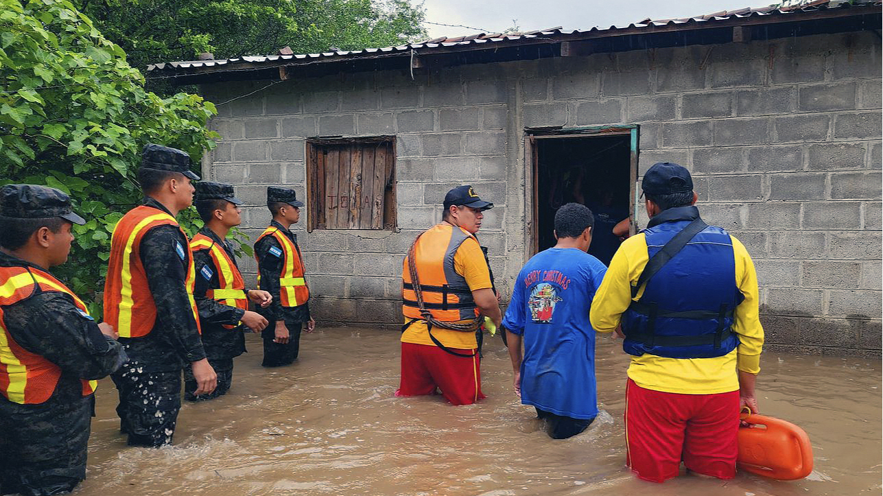 Firefighters carry out rescue work in a flooded area in Nacaome, Valle department, Honduras, June 17, 2024. /CFP 