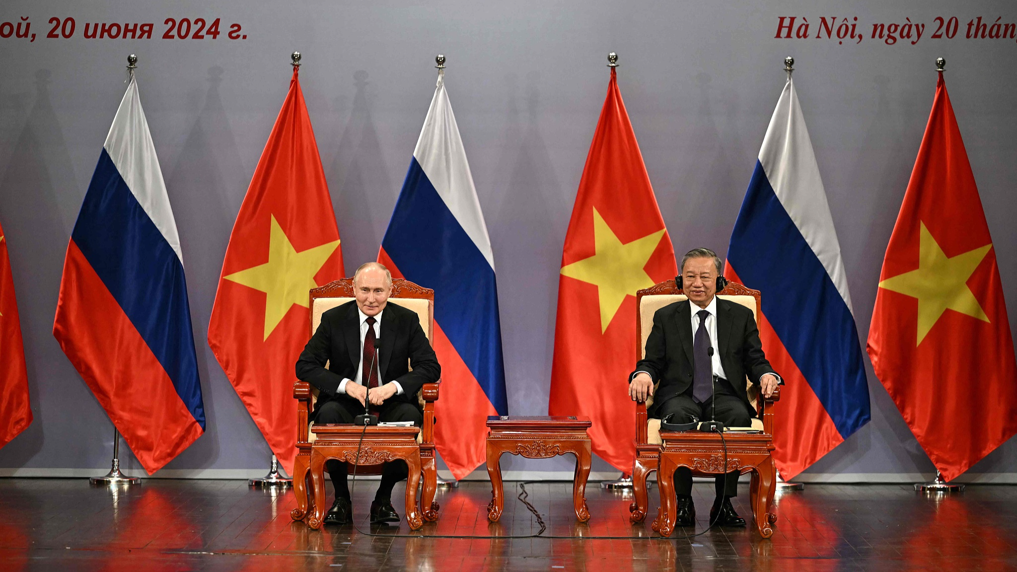Russia's President Vladimir Putin (L) and Vietnam's President To Lam (R) take part in an event attended by the Vietnam Friendship Association and generations of Vietnamese alumni that studied in Russia at the Hanoi Opera House in Hanoi on June 20, 2024. /CFP